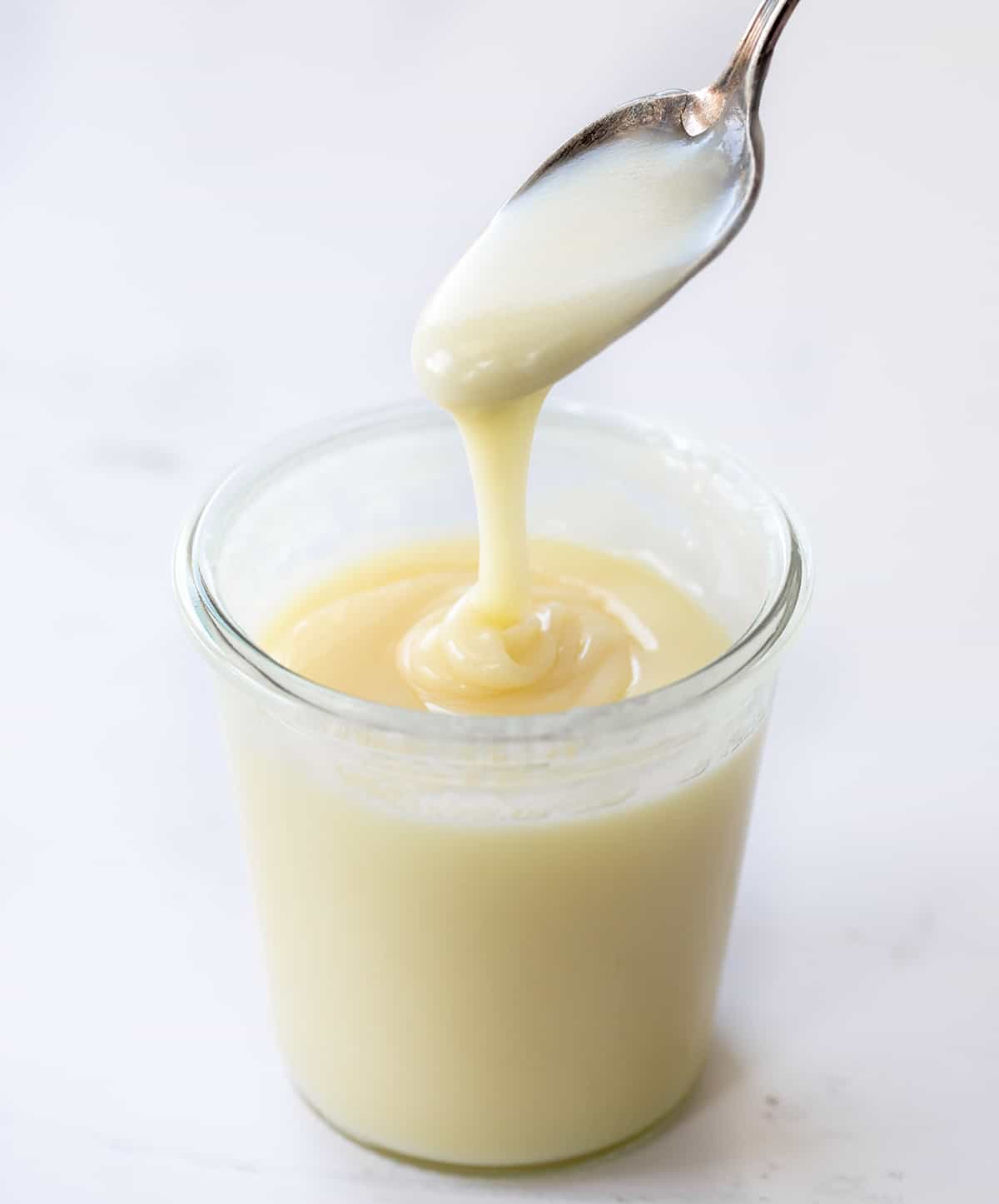 Letting White Chocolate Ganache Drip into a Jar Showing Texture.