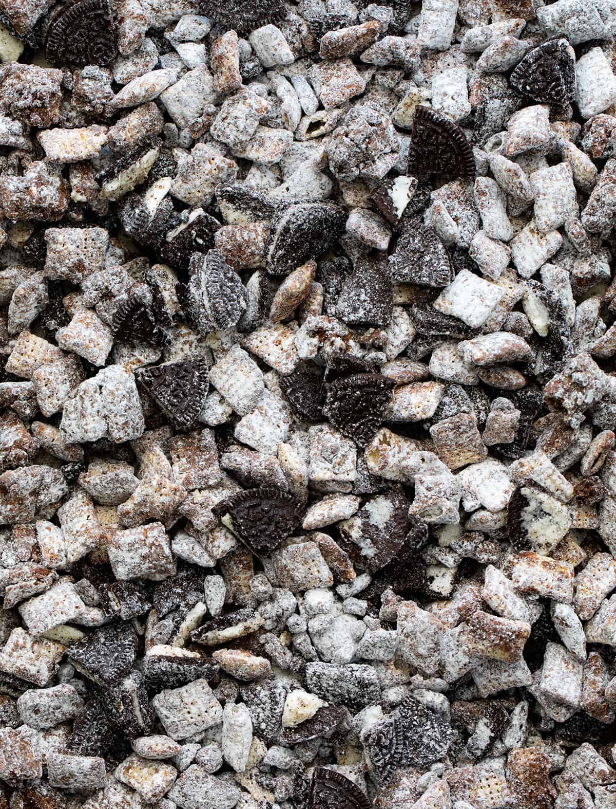 Finished Cookies and Cream Puppy Chow in a Sheet Pan Only Showing the Puppy Chow Close up.