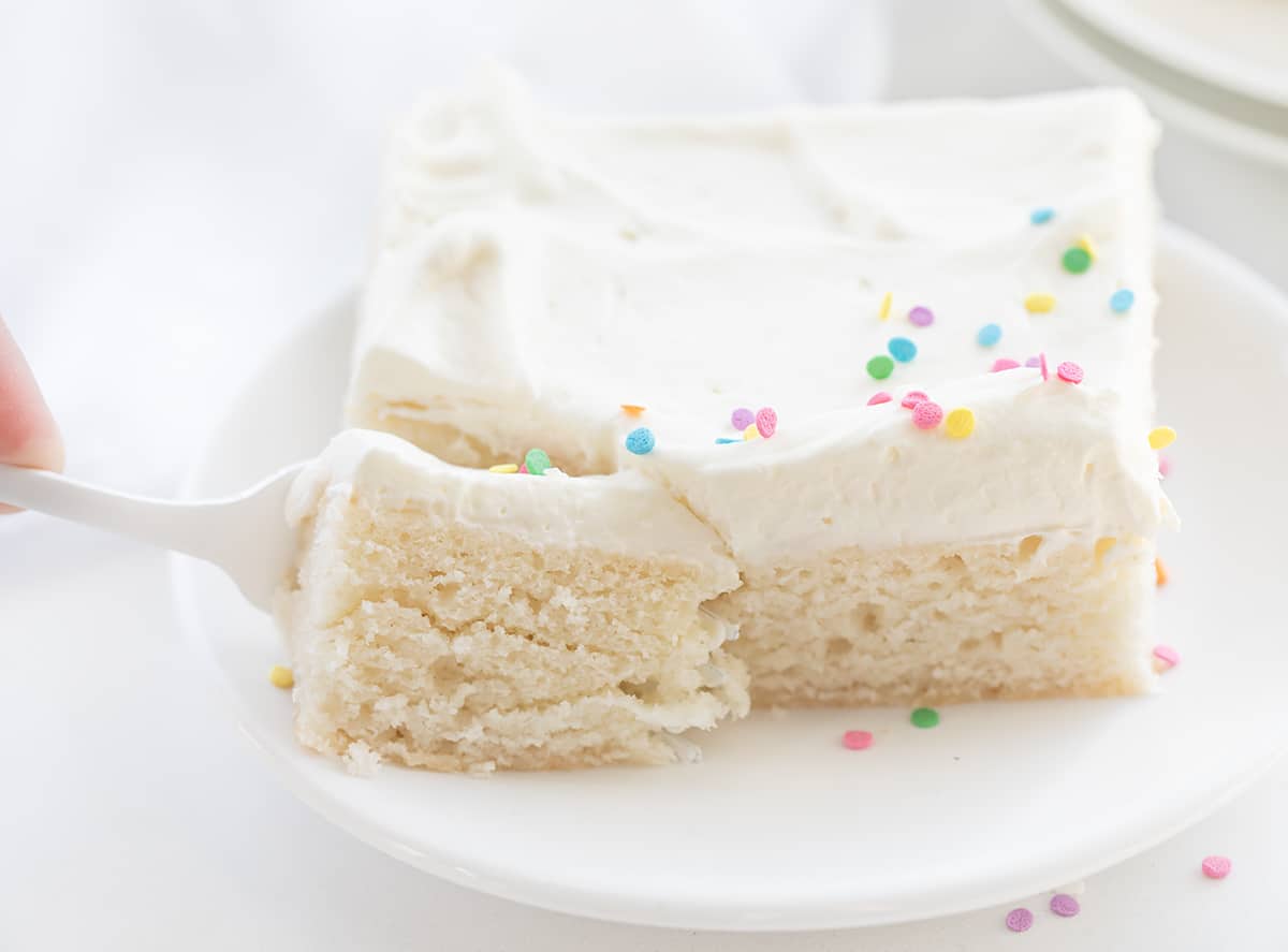 Fork Taking a Bite Out of Vanilla-Delight Cake - White Cake.