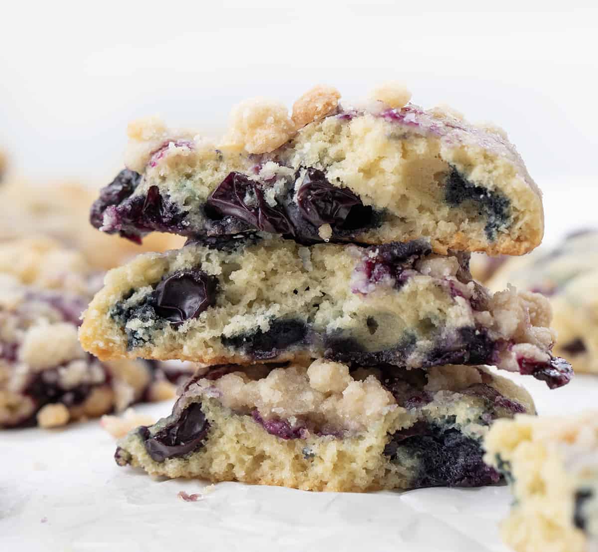 Blueberry Crumble Cake Cookies Broken in Half and Stacked, Showing Inside Texture.
