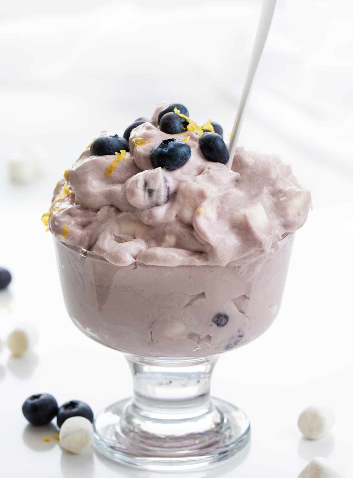 Parfait of Blueberry Lemon Fluff with White Spoon.