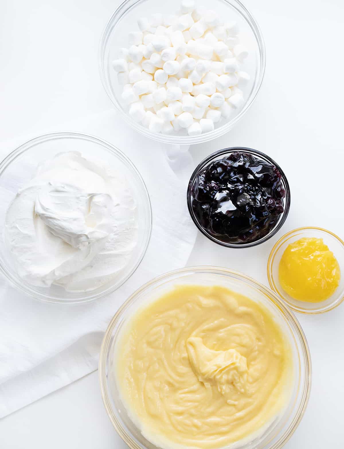 Ingredients to Make Blueberry Lemon Fluff in Glass Bowls.