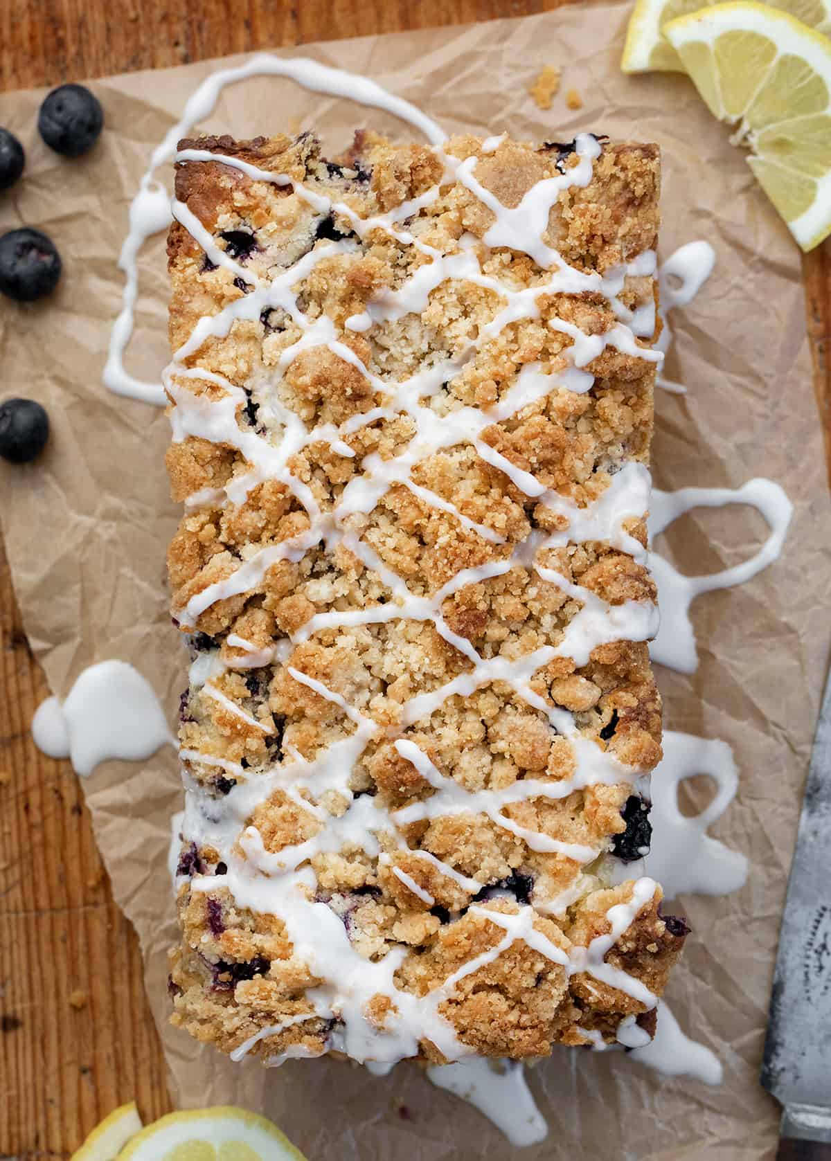 Blueberry Lemon Loaf on a Cutting Board Covered in Glaze Just like Copycat Costco Recipe.