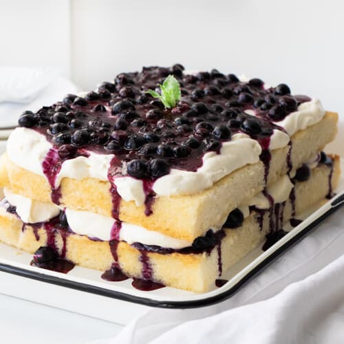 Whole Sheet Pan Blueberry Shortcake Cake on a White Counter.