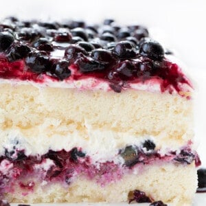Cut Into Sheet Pan Blueberry Shortcake Cake Showing Soft Layers.