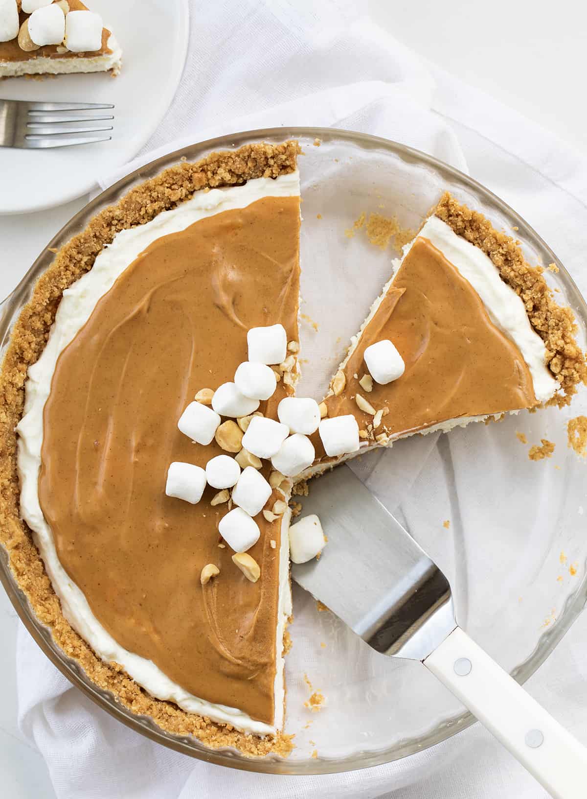 Cut Into Fluffernutter Pie with Three Pieces Removed and One Left in the Pie Plate and a Spatula.