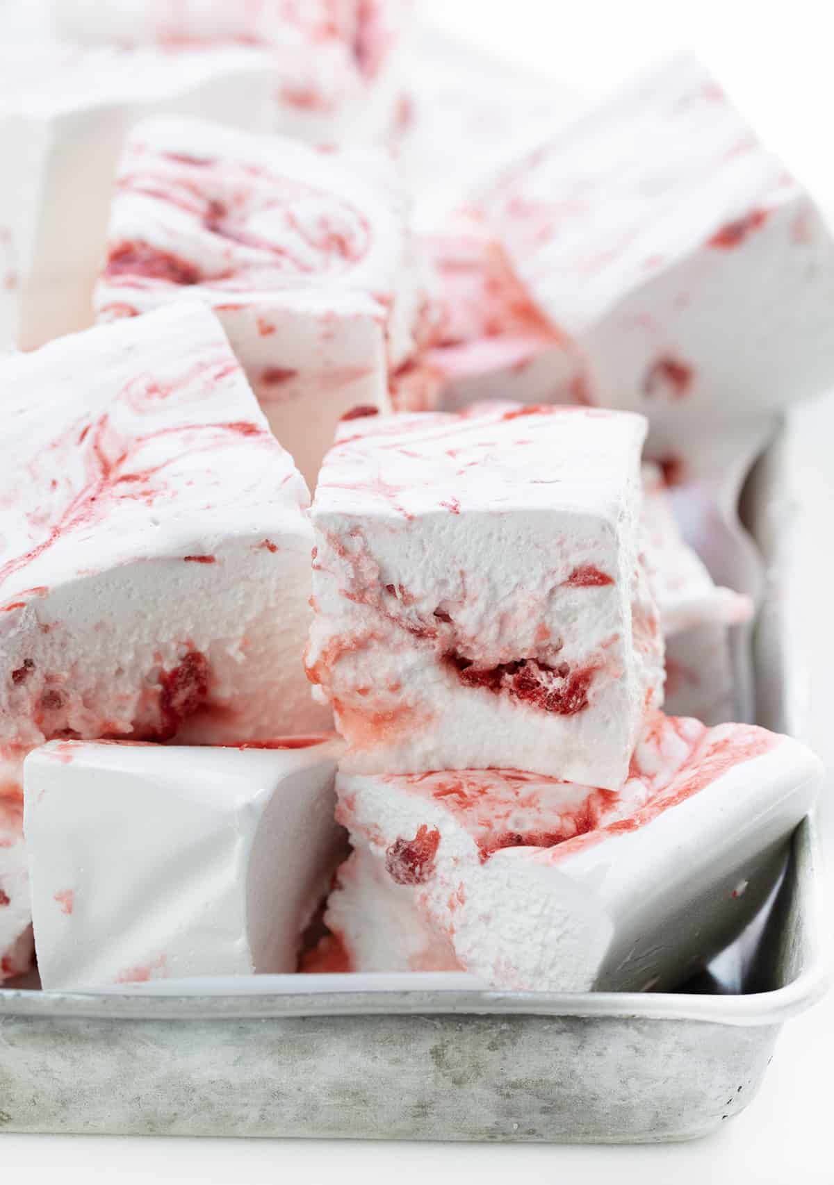 Cut up Strawberry Marshmallows in a Pan.