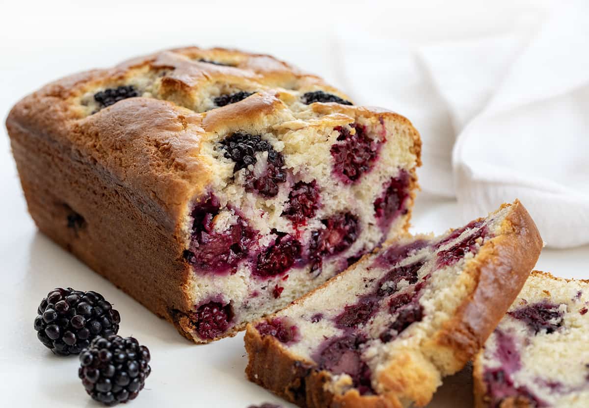 Close up of Blackberry Loaf with Some Pieces Cut and Showing Inside Texture.
