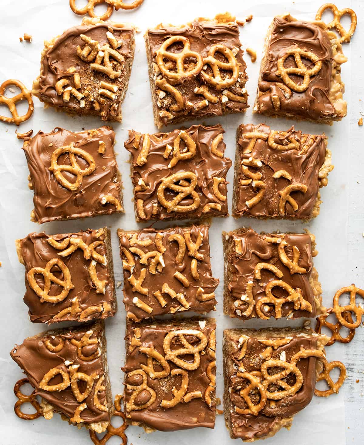 Pretzel Scotcheroo Bars from Overhead on a White Counter with a few Pretzels Around. 