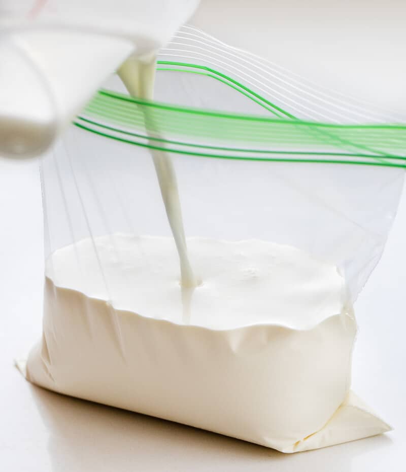 Adding Milk and Heavy Cream to a Plastic Bag to Make Soft Serve Ice Cream.