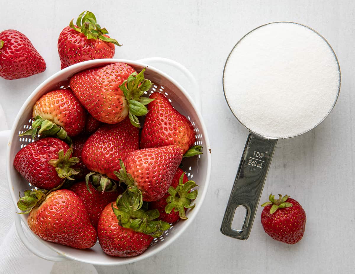 Raw Strawberries and Sugar Before Making Strawberry Simple Syrup.