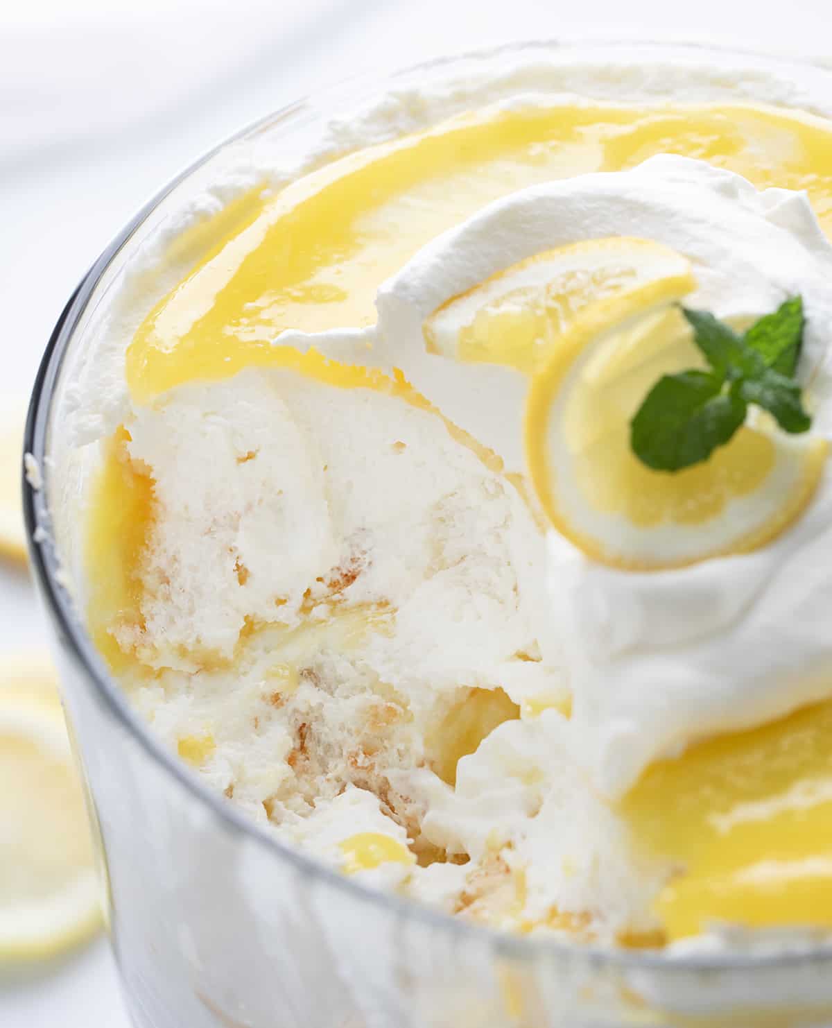 Lemon Cream Trifle with some Removed Showing the Gooey Texture inside.