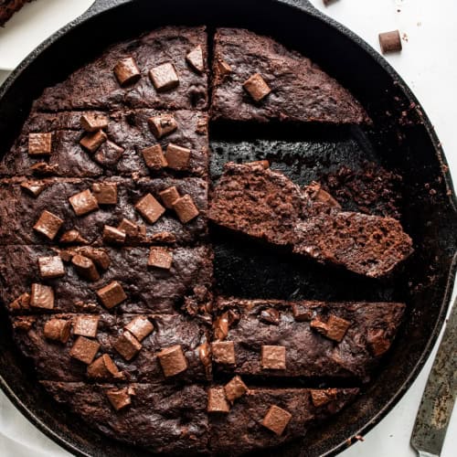 Pan of Chocolate Focaccia Bread Cut Into Strips and a Couple of Pieces Missing and One Piece on Its Side.