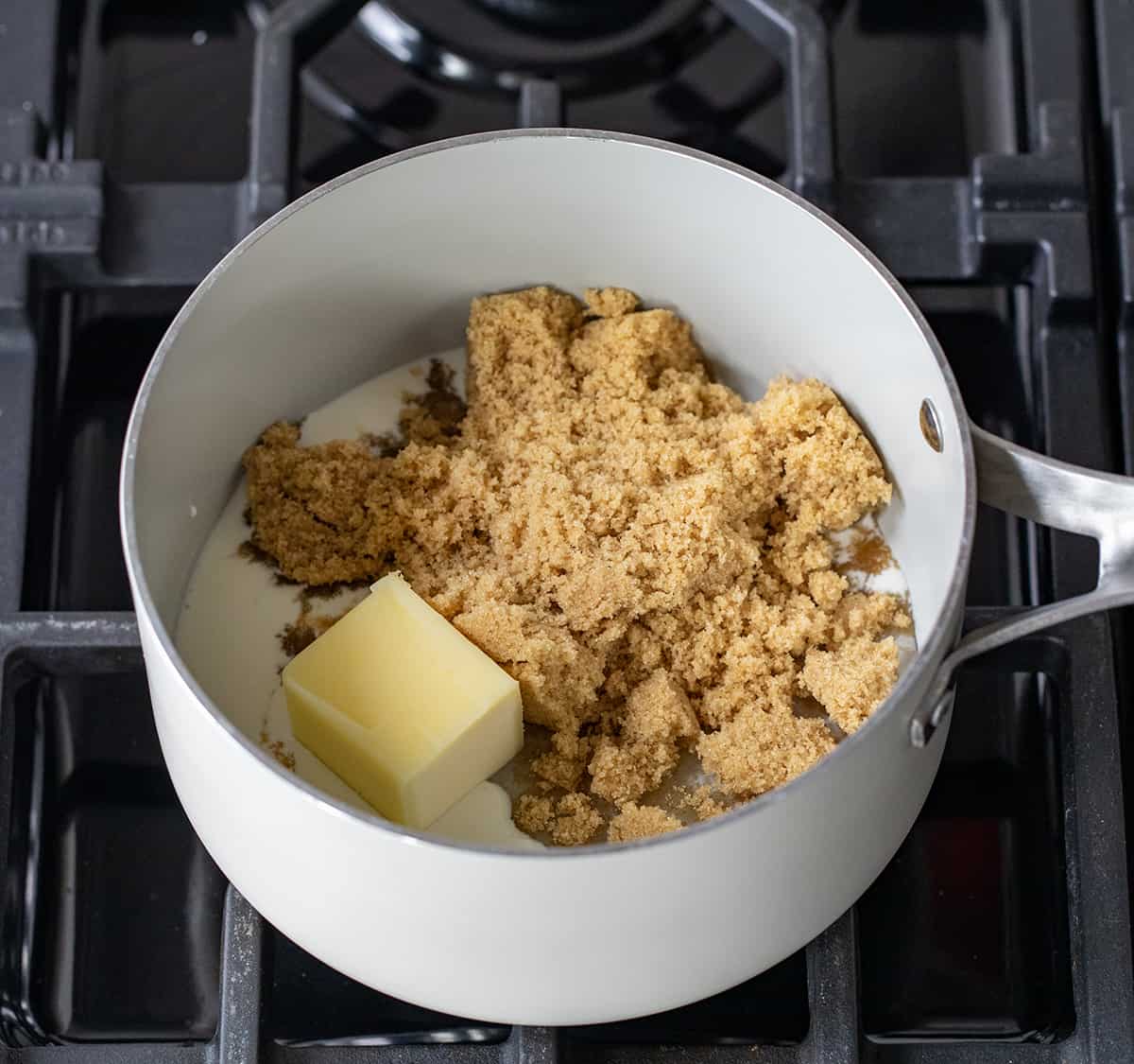 Pan of Raw Ingredients to Make Butterscotch Sauce on a Burner.