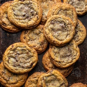 Browned Butter Chocolate Chip Cookies from Overhead on a Dark Surface.