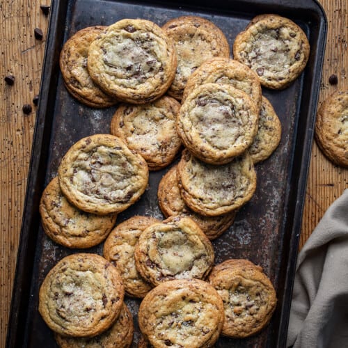 Sheet Pan Covered in Browned Butter Chocolate Chip Cookies on a Table from Overhead.