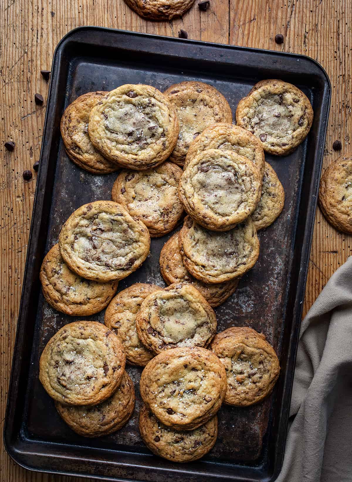 Sheet Pan Covered in Browned Butter Chocolate Chip Cookies on a Table from Overhead. 
