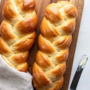 Easy Challah Bread on White Counter with a Butter.