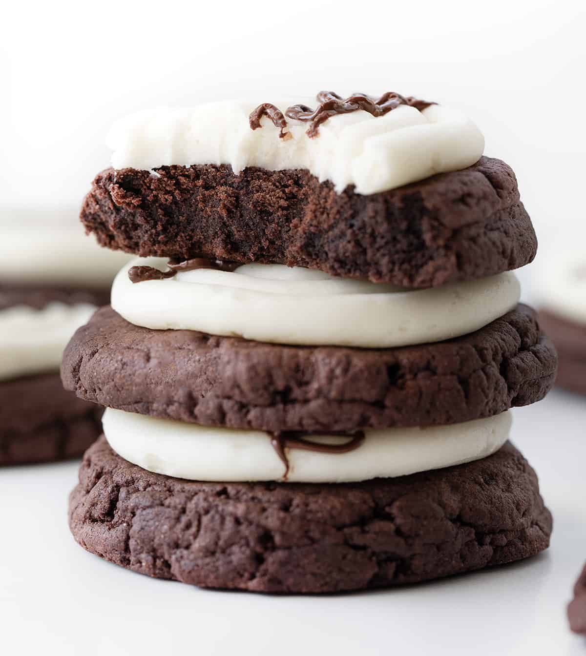 Stack of Marshmallow Dream Cookies with Top Cookie Missing a Bite Showing the Inside Texture.