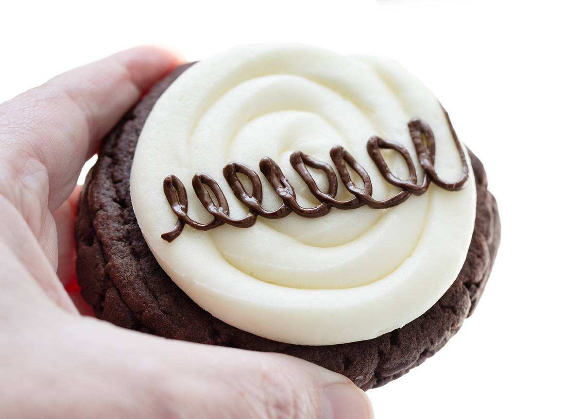 Hand Holding a Marshmallow Dream Cookie.