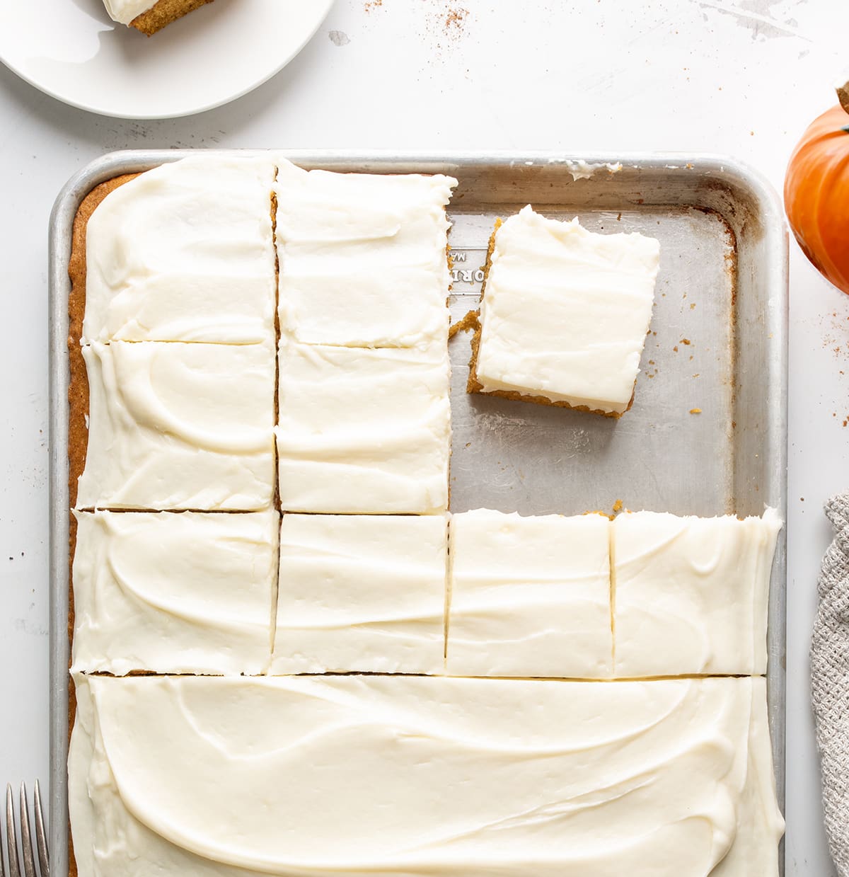 Sheet Pan of Pumpkin Bars with Some Bars Cut and Removed. 