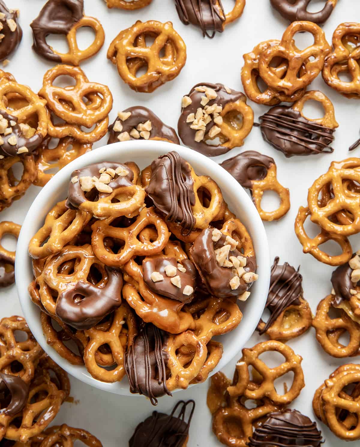 Bowl of Butter Toffee Pretzels with some covered in chocolate from overhead.