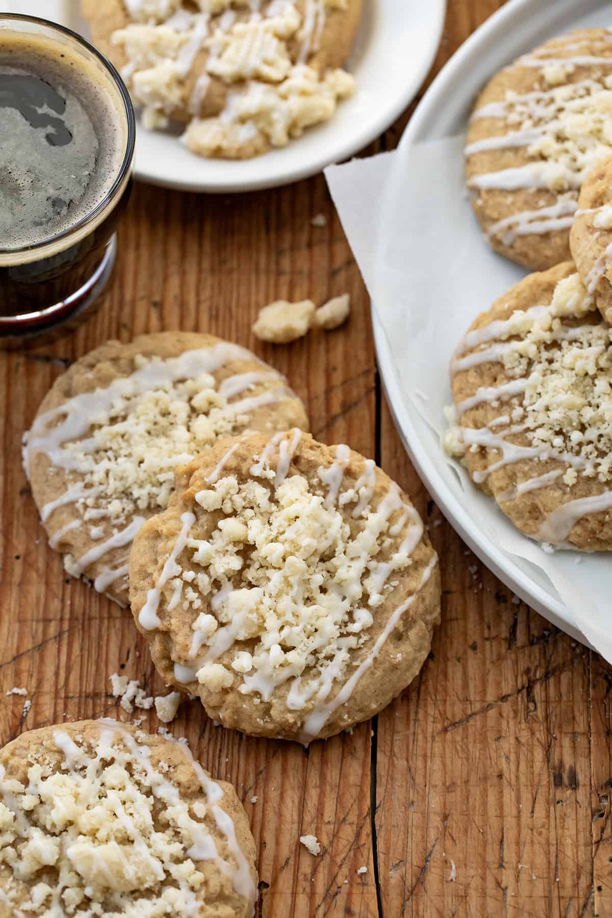 Coffee Cake Cookies on a table next to a plate with coffee.