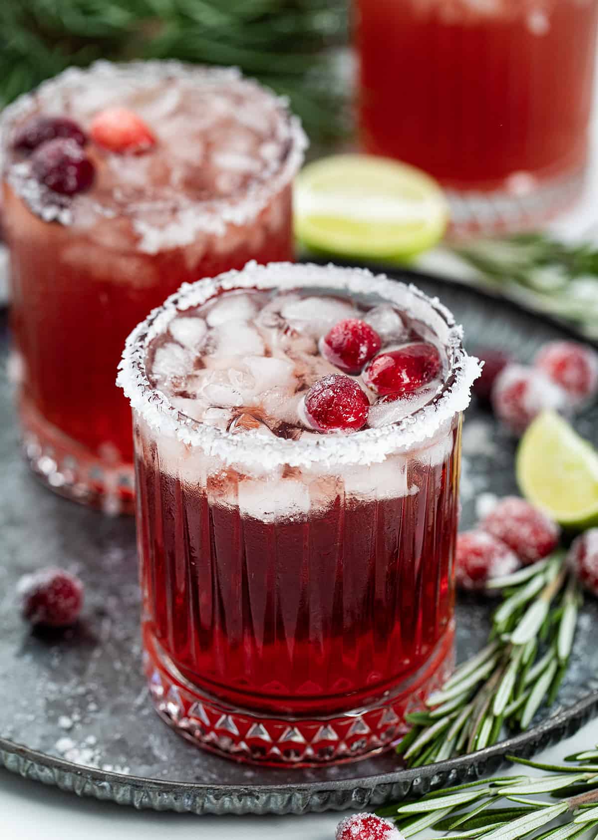 Cranberry Margaritas on a platter with christmas decorations.