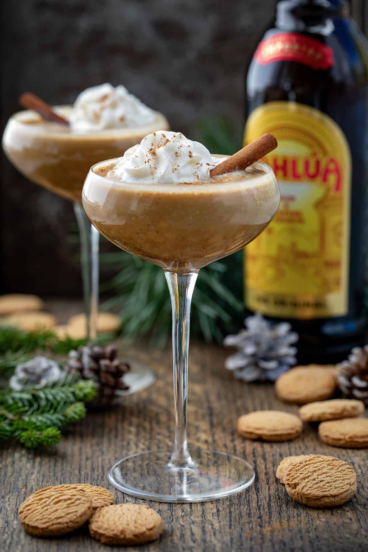Glasses filled with Gingerbread Martini on a Dark Table.