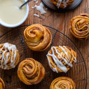 Pumpkin Spice Cruffins on a rack some with glaze and some without from overhead.