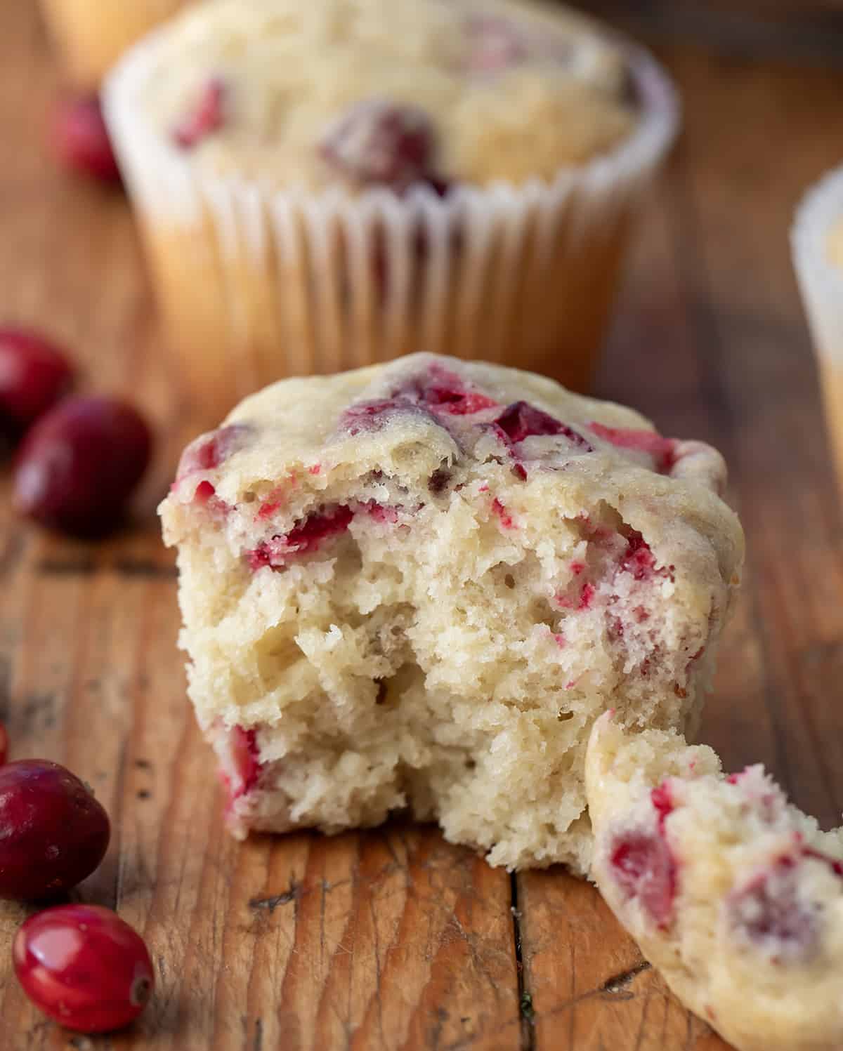 Cranberry Banana Muffin halved showing tender crumb inside.