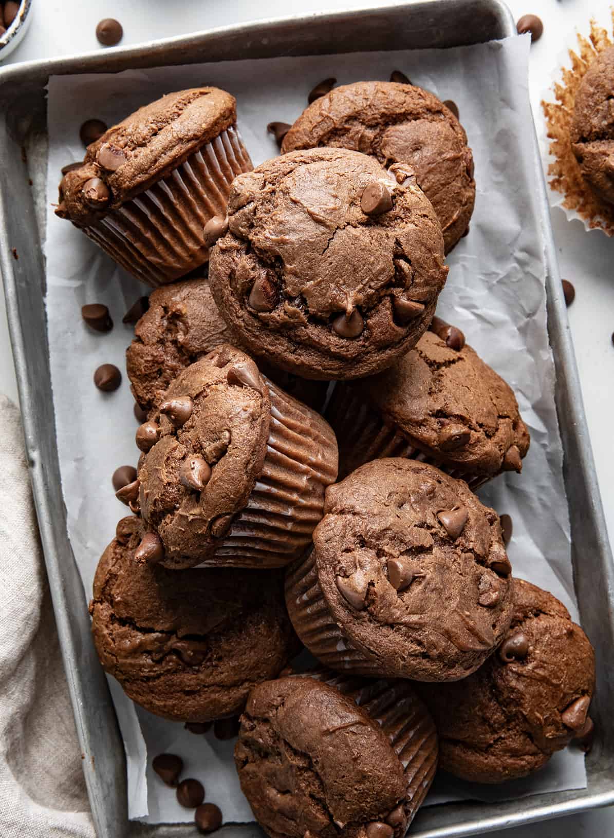 Chocolate Cream Cheese Muffins on a table from overhead.