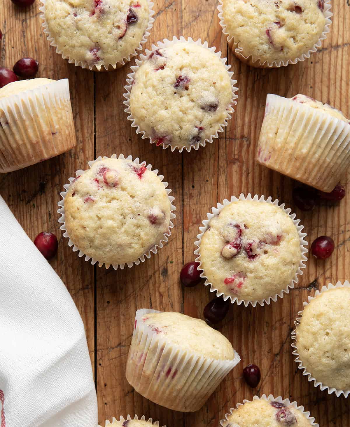 Cranberry Banana Muffins on a wooden table from overhead.