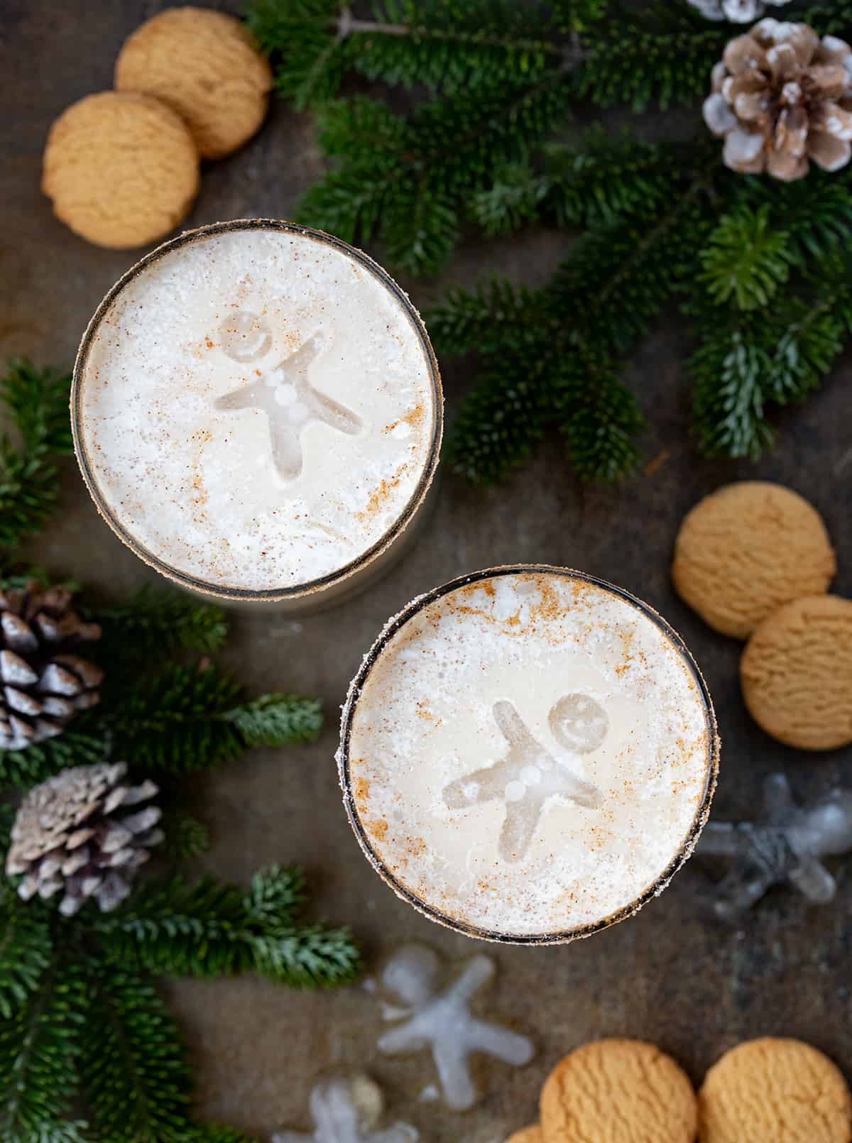 Gingerbread White Russian cocktails from overhead with gingerbread men ice cubes floating on top.