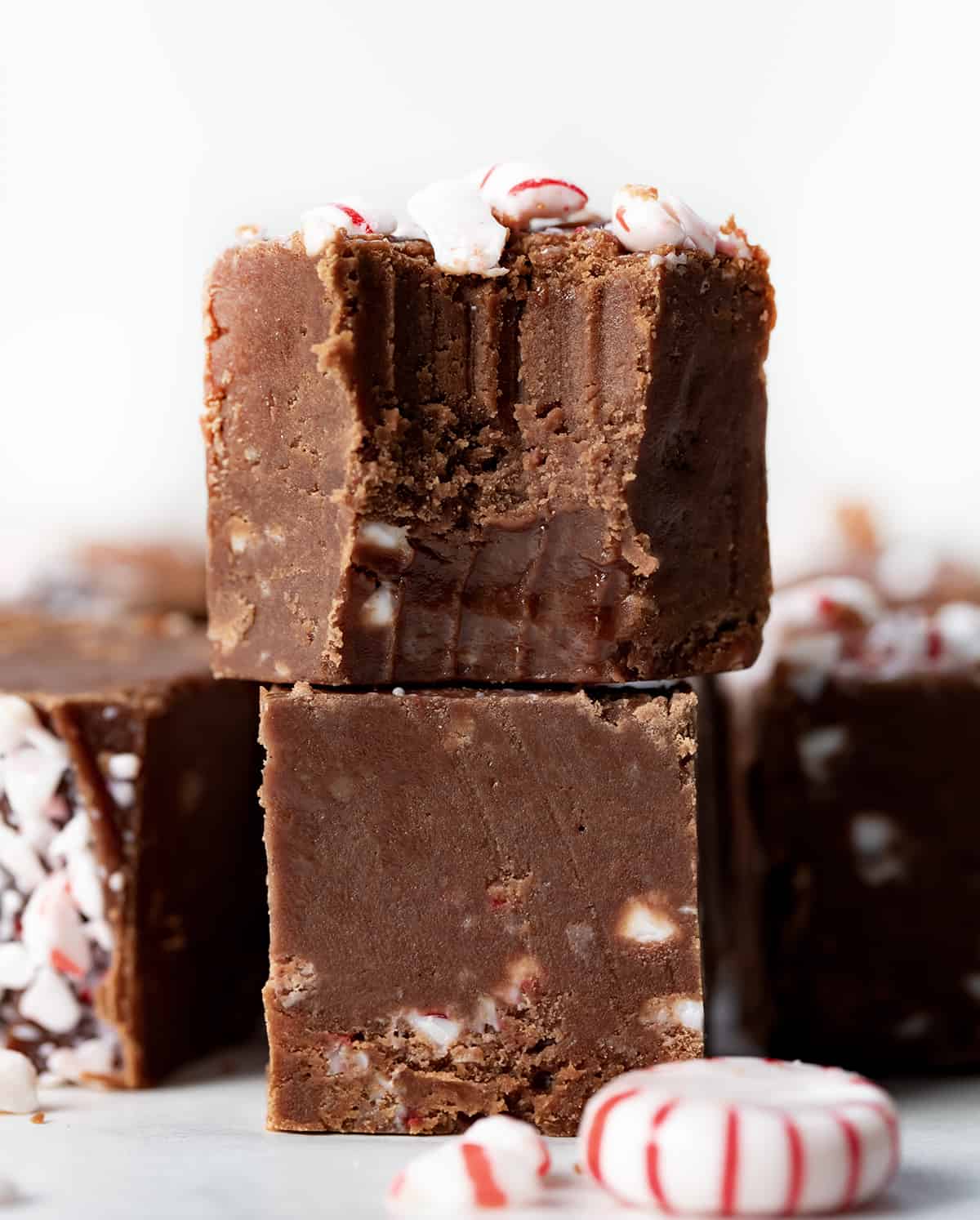 Bit into Peppermint Fudge stacked on a counter.