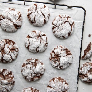 Chocolate Crinkle Cookies on a rack spaced out from overhead.