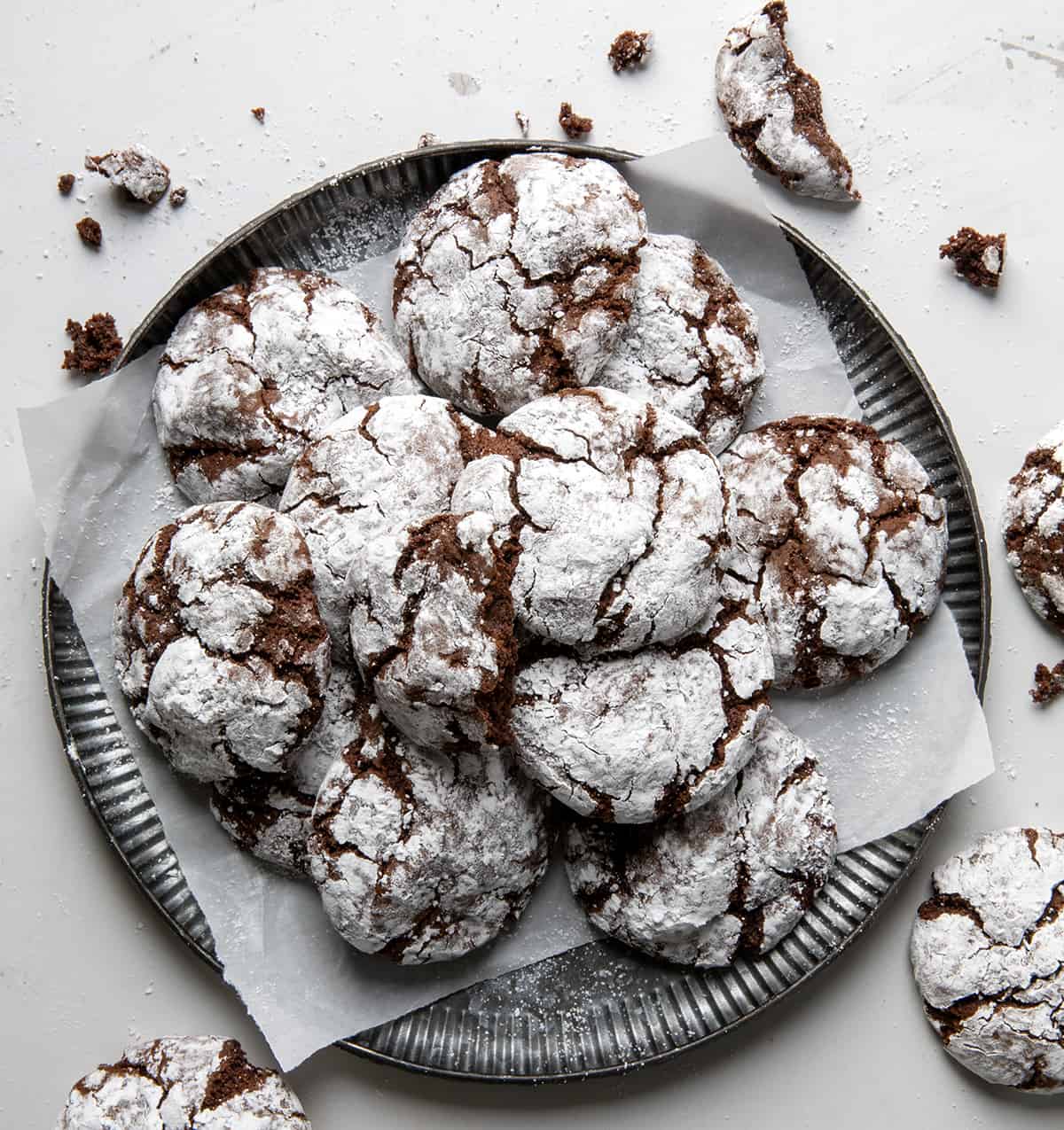 Tray of Chocolate Crinkle Cookies on a white counter from overhead.