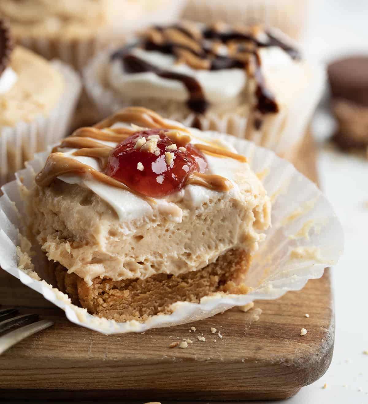 One Mini Peanut Butter Cheesecakes cut in half showing texture.
