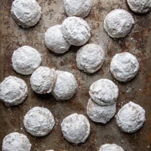 Pfeffernüsse Cookies on a sheet pan from overhead.