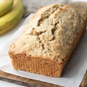 Loaf of Bisquick™ Banana Bread on a white counter.
