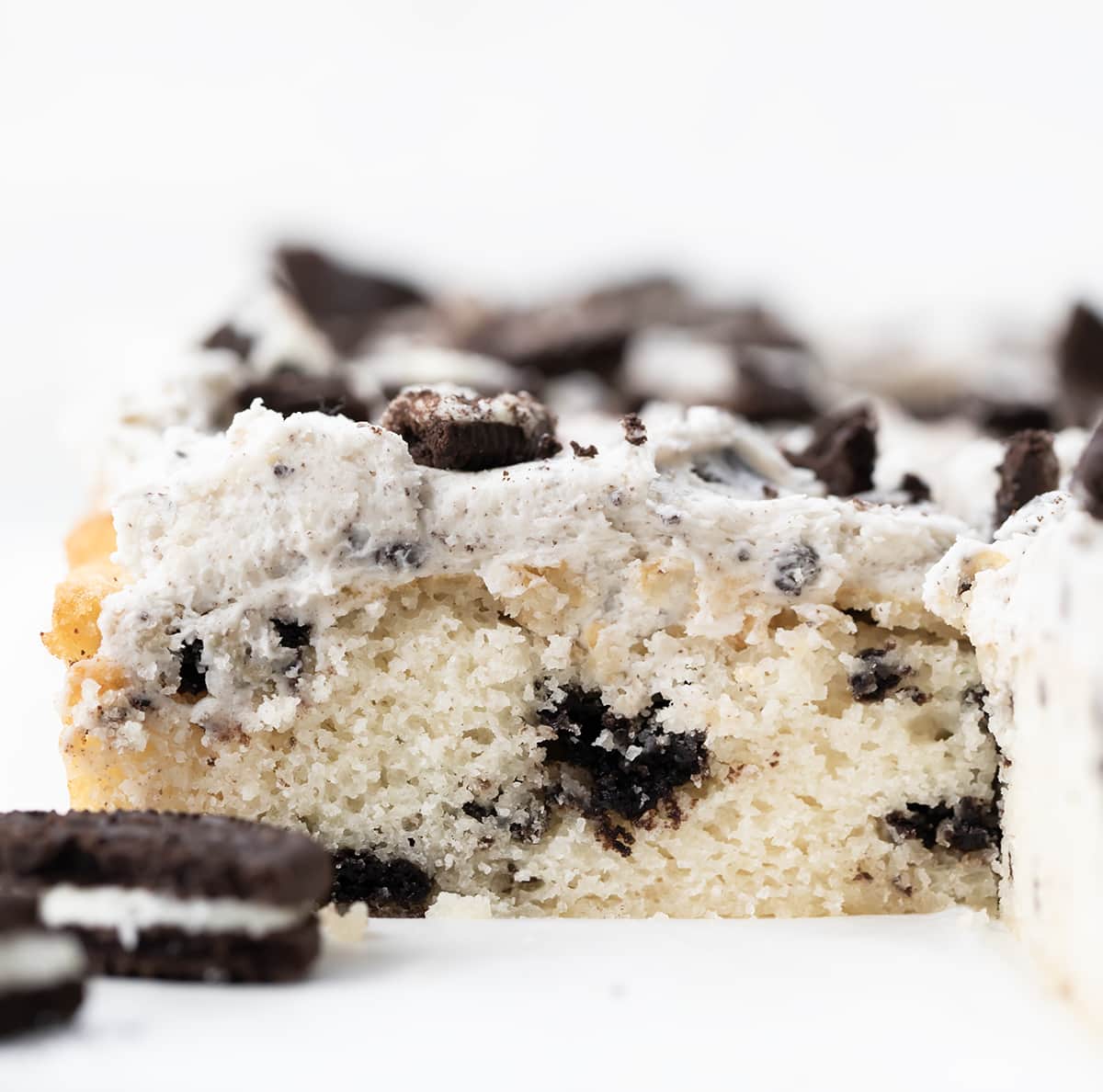 Piece of Cookies and Cream Sheet Cake close up showing tender crumb.