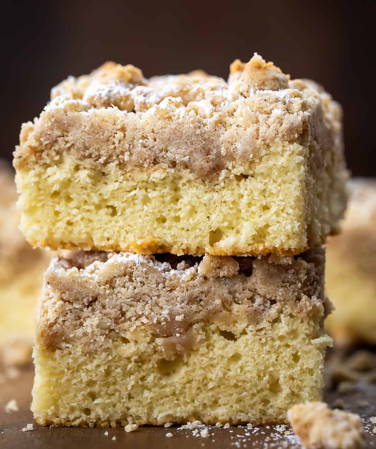 Crumb Cake stacked on a wooden table.