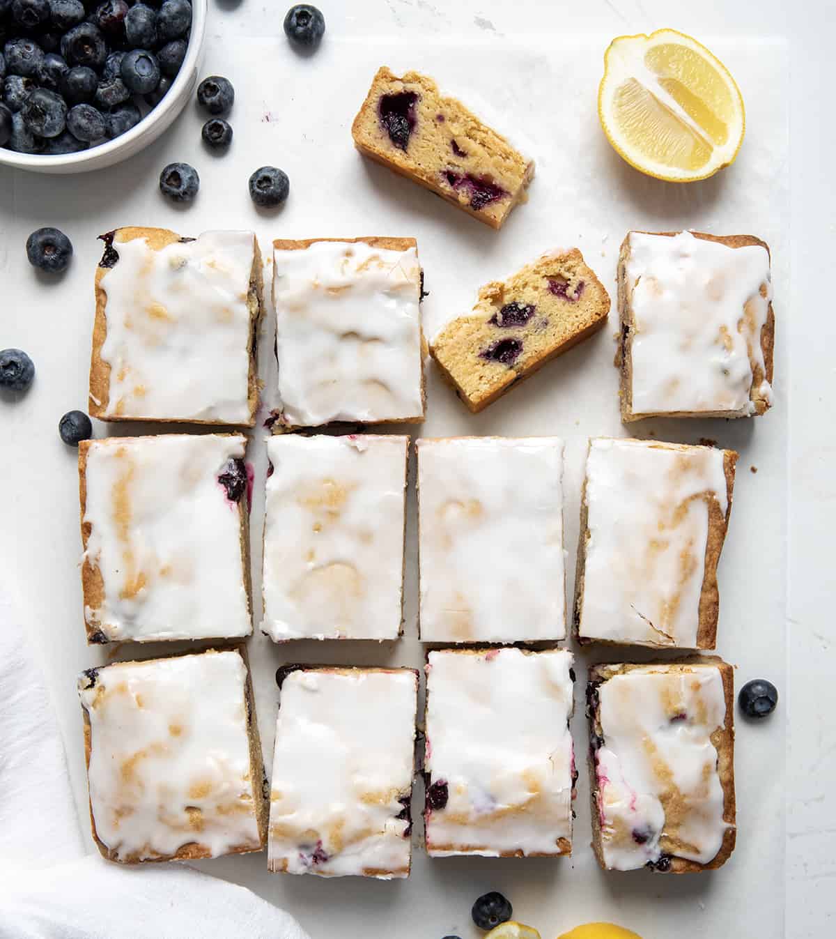 Lemon Blueberry Blondies cut into pieces with some showing texture inside.