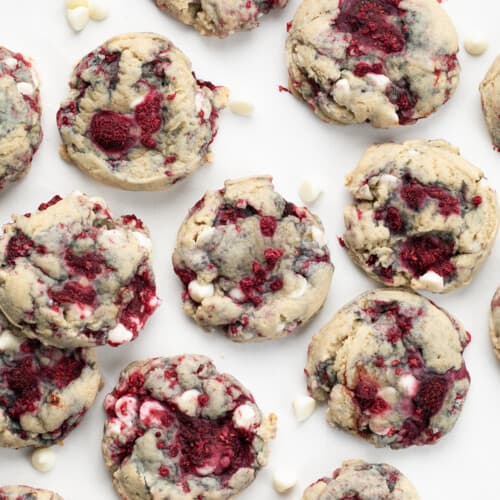 White Chocolate Raspberry Cookies on a white Table from overhead.