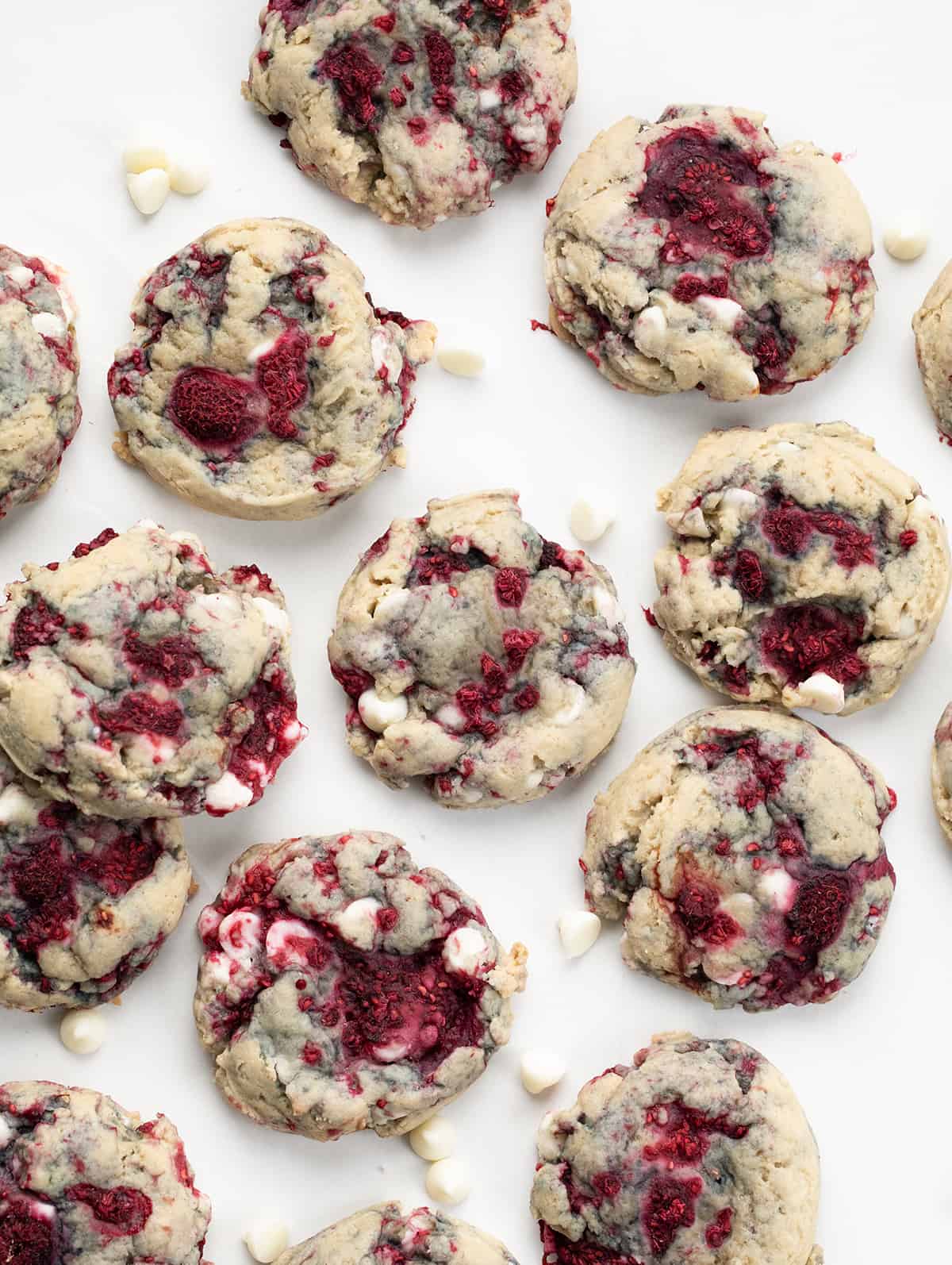 White Chocolate Raspberry Cookies on a white Table from overhead.