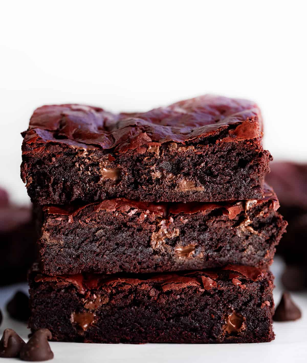 Stack of Red Velvet Brownies showing the chewy texture inside.