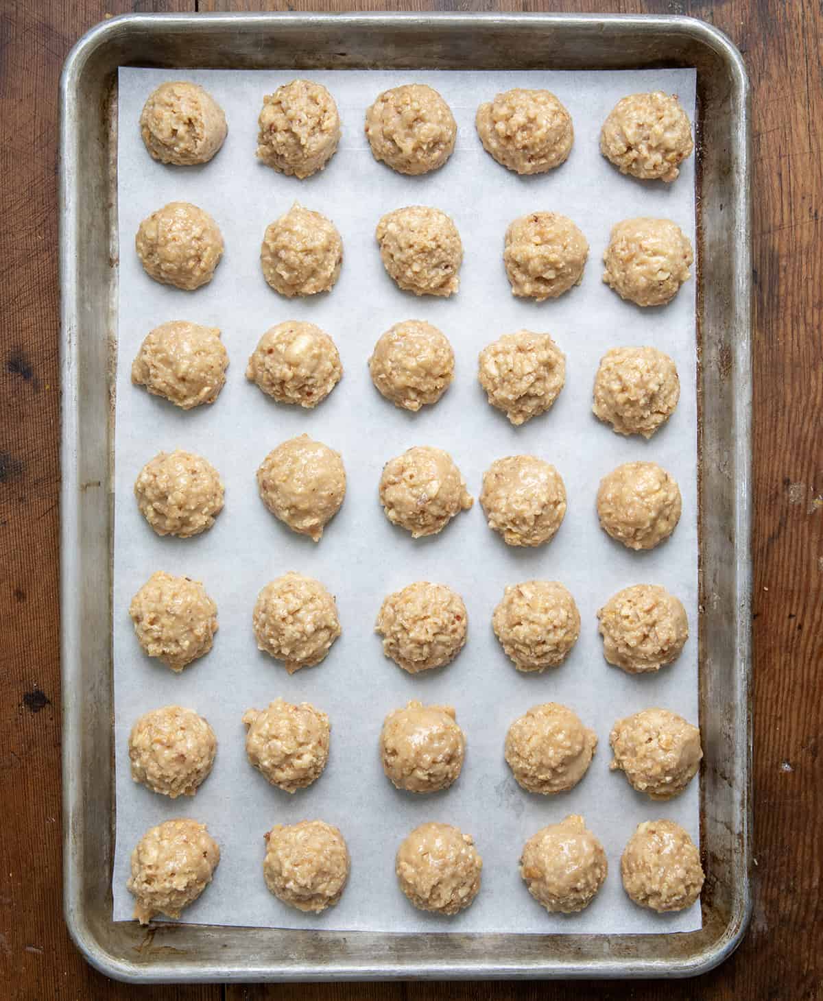 $300 Candy, or graham cracker candy, balls on a sheet pan from overhead.