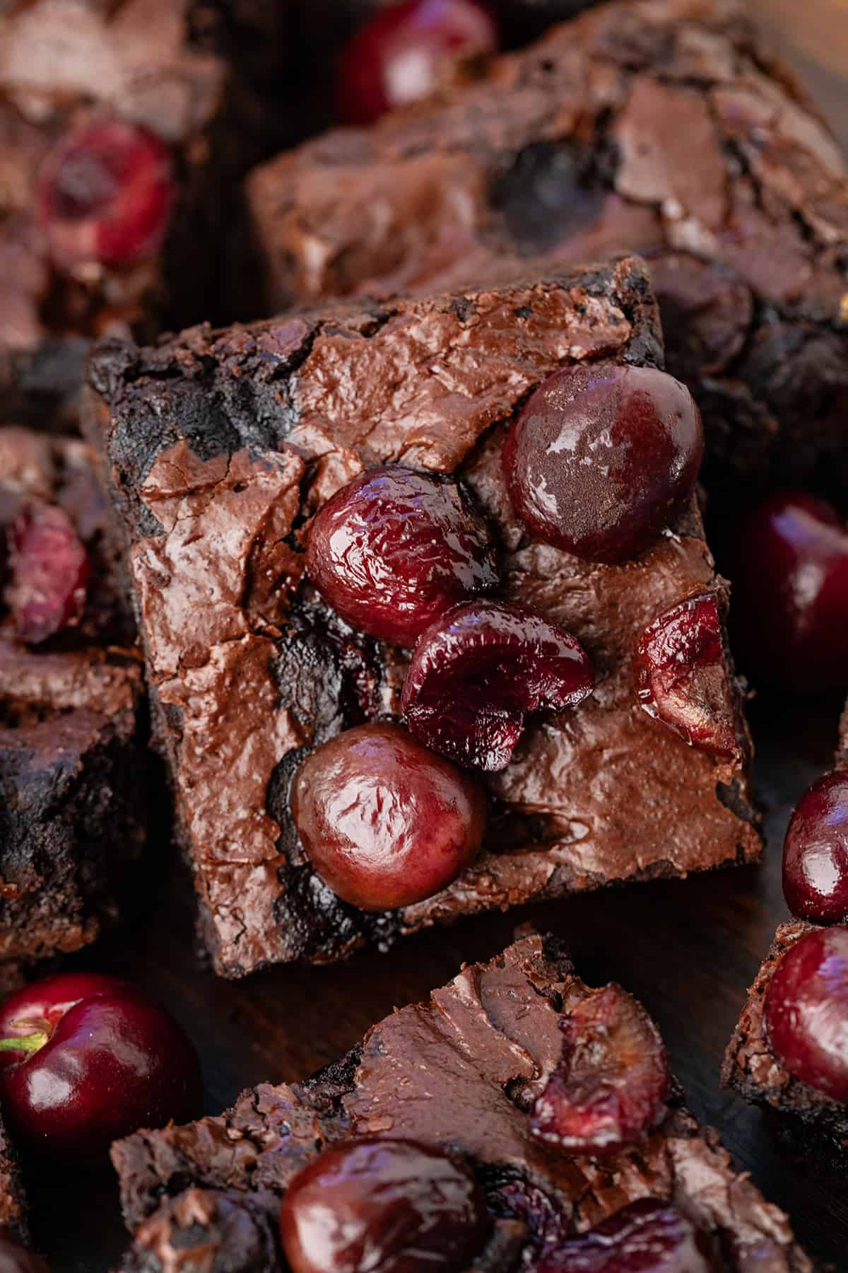Close up of Roasted Cherry Brownies stacked on top of each other.