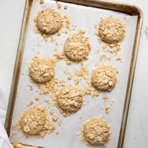 Pan of Maple Pecan Coffee Cake Cookies on a white counter from overhead.