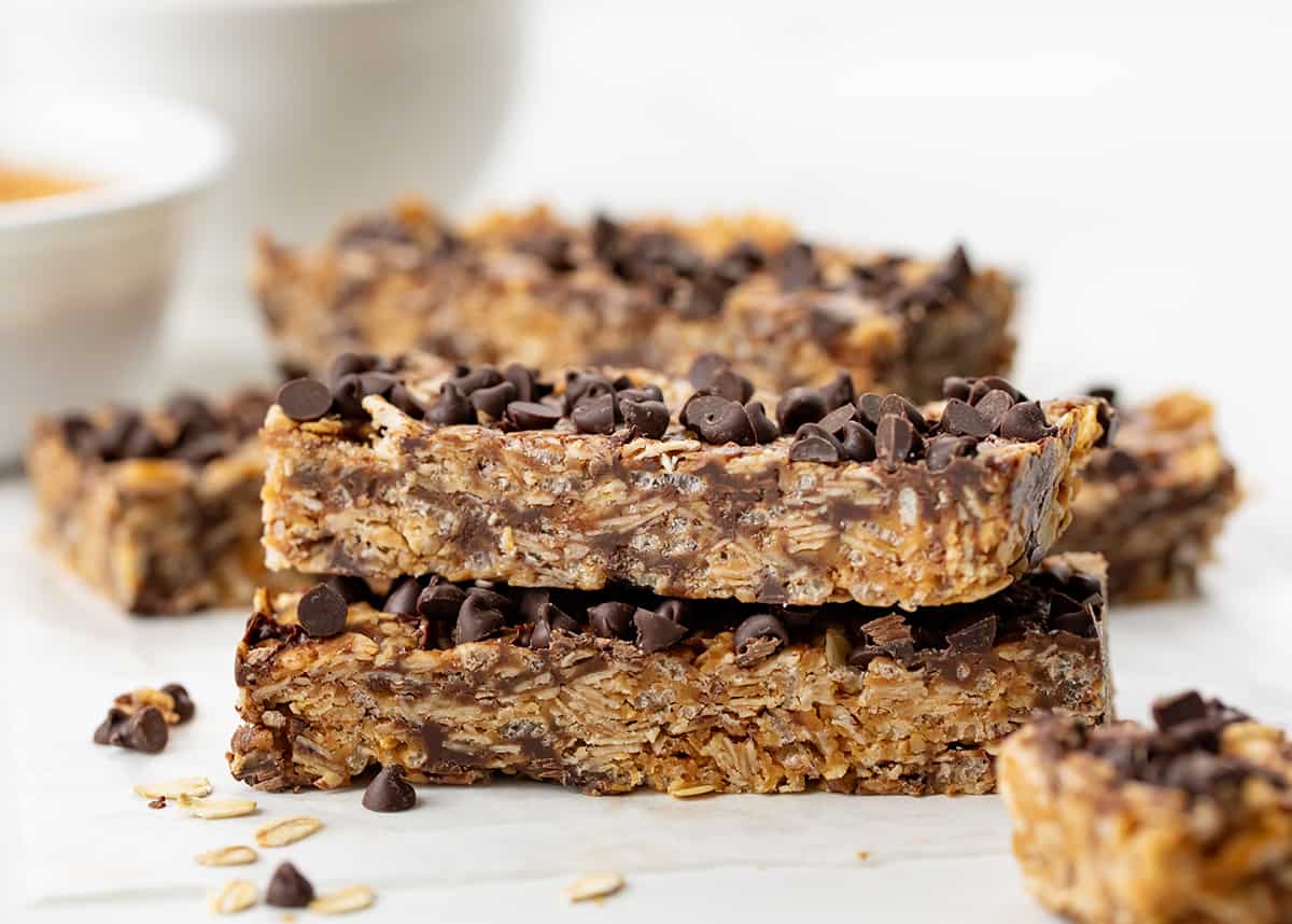 Stack of No Bake Chewy Granola Bars on a white counter.
